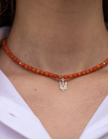 One string terracotta coral necklace, silver trident