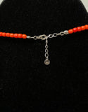 One string terracotta coral necklace, silver trident