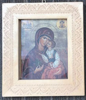 Virgin Mary and Jesus icon in carved frame