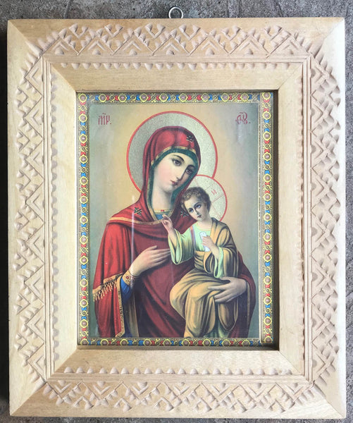 Virgin Mary and Jesus icon in carved frame